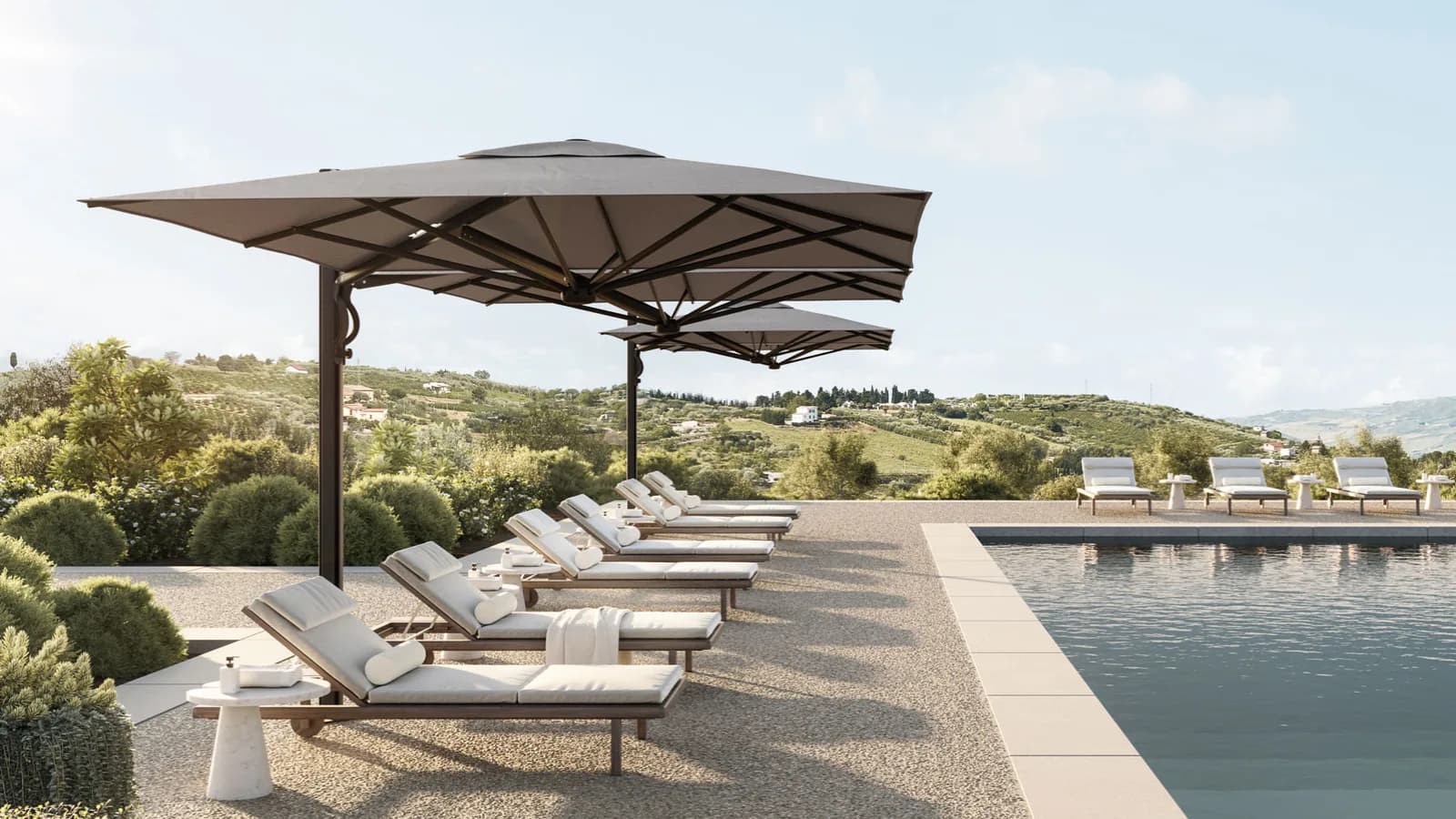 Outdoor cafe setting sheltered by a large Shade7 Galaxy umbrella