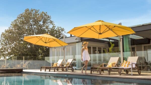 Shade7 Riviera cantilever umbrellas shading an outdoor dining area