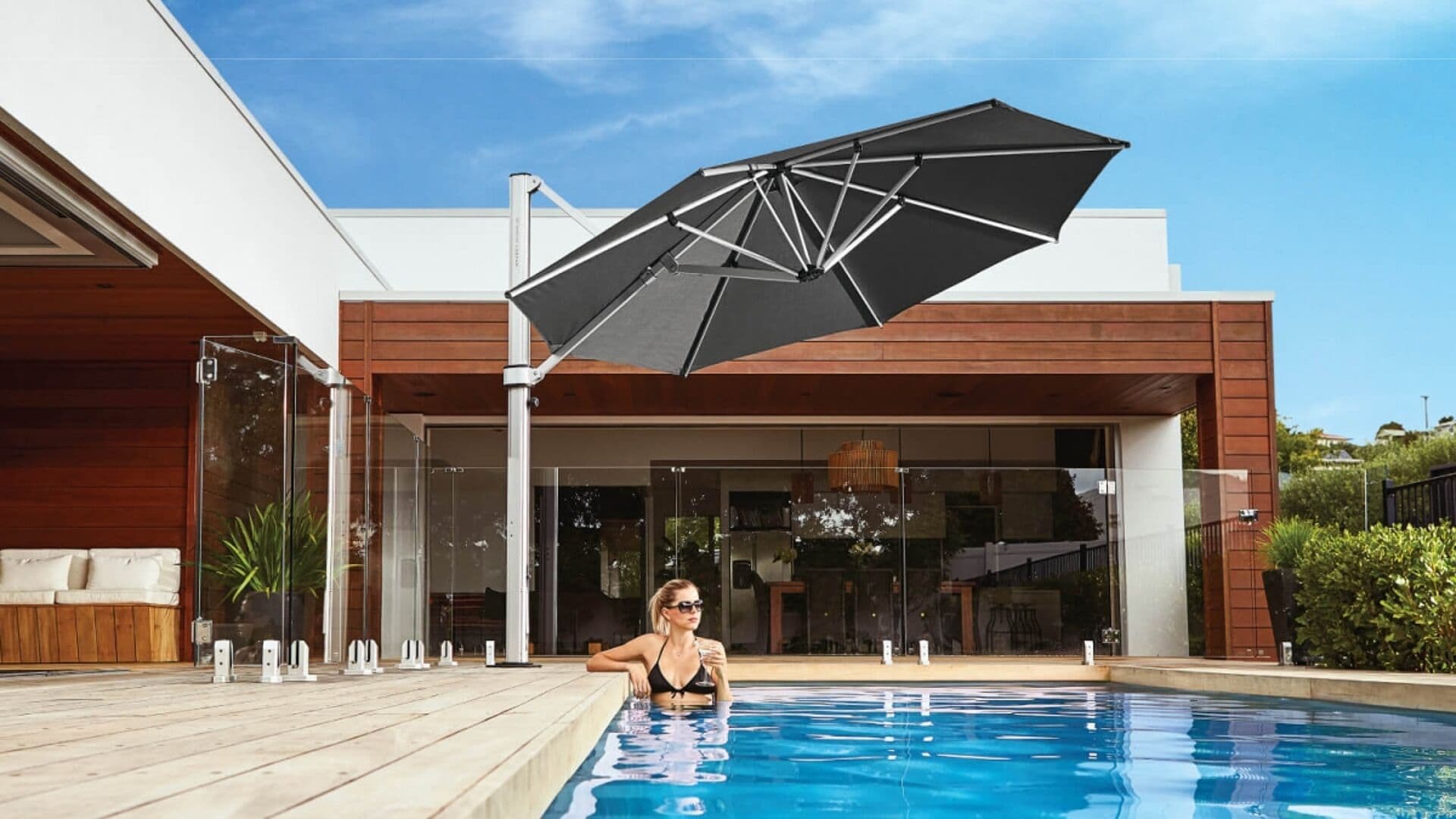Charcoal grey Shade7 Riviera cantilever umbrella shading a modern patio