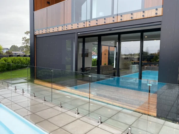 Clear Ziptrak outdoor blinds enclosing a covered patio