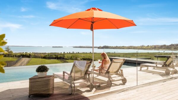 Orange Shade7 Venice outdoor umbrella shading poolside loungers