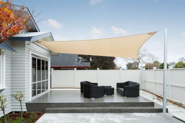 Grey Shadetex shade sail installed over an outdoor living area